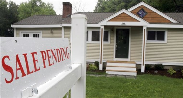 A sign shows that a residential home sale is pending June 1 in the Boston suburb of Framingham, Mass.